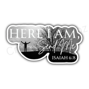 May include: Black and white sticker with a silhouette of a person with arms raised, a tree, and the text "HERE I AM, Send Me" with the scripture reference "ISAIAH 6:8".