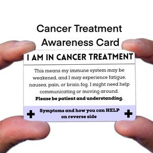 May include: A white card with the text "Cancer Treatment Awareness Card" and "I AM IN CANCER TREATMENT". The card explains potential side effects of treatment and asks for patience. The card is held between two hands.