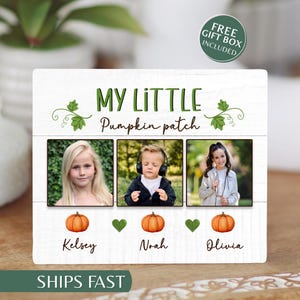 May include: A rectangular white wooden sign with the text MY LITTLE Pumpkin patch. It features three square photo frames showing a girl, a boy with headphones, and a girl. Below each photo is an orange pumpkin, a green heart, and the names Kelsey, Noah, and Olivia.