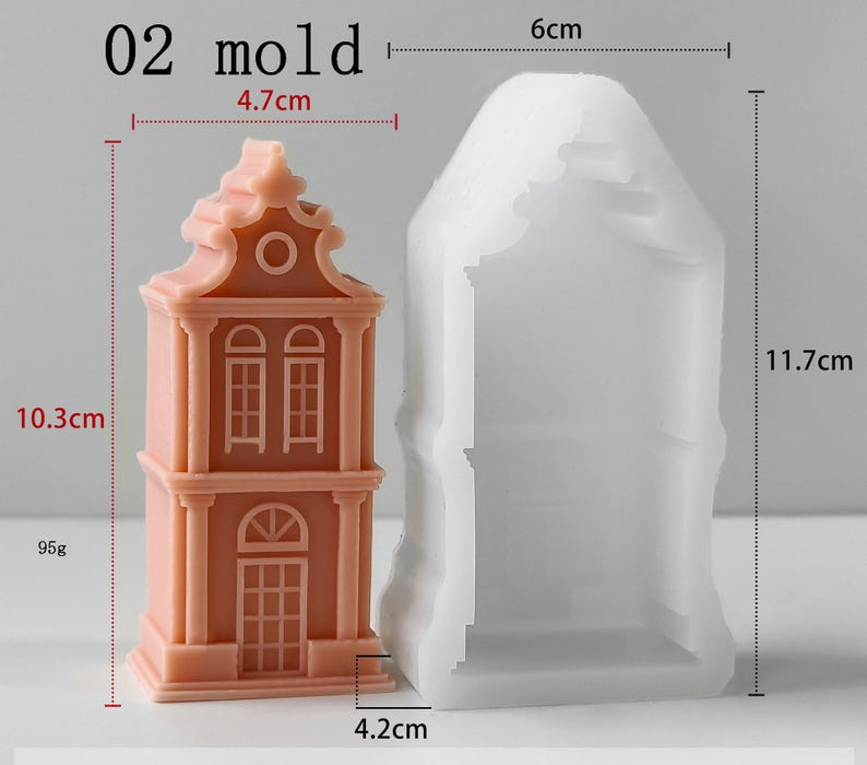 May include: A peach-colored house-shaped object next to a translucent white silicone mold. The object measures 10.3 cm in height, 4.7 cm in width, and weighs 95g. The mold measures 11.7 cm in height, 6 cm in width, and 4.2 cm in depth. Text reads 02 mold.