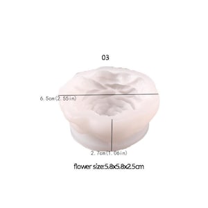 May include: A white silicone mold in the shape of a rose. The mold is 2.55 inches in diameter and 1.06 inches tall. The flower size is 2.3 x 2.3 x 1 inches. The number "03" is printed at the top.