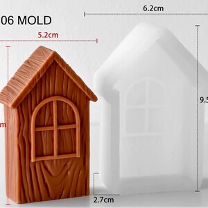 May include: A brown house-shaped object with wood grain texture and an arched window next to a translucent white silicone mold. The brown object measures 5.2 cm wide by 8.5 cm high. The silicone mold measures 6.2 cm wide by 9.5 cm high and 2.7 cm deep.