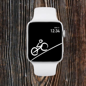 May include: A white Apple Watch with a black face displaying the time 12:34 and the date MON 12. A white silhouette of a person riding a bicycle uphill is on the watch face.