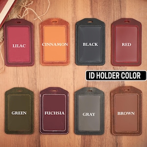 May include: Ten leather ID badge holders in various colors, including lilac, cinnamon, black, red, green, fuchsia, gray, and brown. The text "ID Holder Color" is printed below the holders.