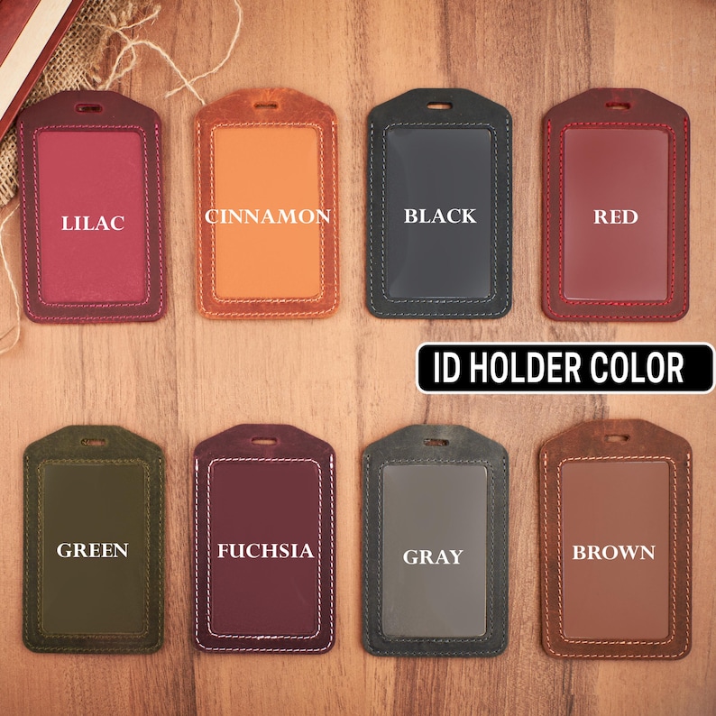 May include: Ten leather ID badge holders in various colors, including lilac, cinnamon, black, red, green, fuchsia, gray, and brown. The text "ID Holder Color" is printed below the holders.