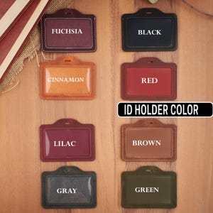 May include: Eight leather ID card holders in different colors: fuchsia, black, cinnamon, red, lilac, brown, gray, and green.  ID Holder Color.