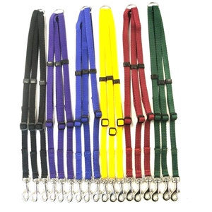 May include: Set of ten dog leads in various colours, including black, purple, blue, yellow, red, and green. Each lead has two clips and is made of durable webbing.