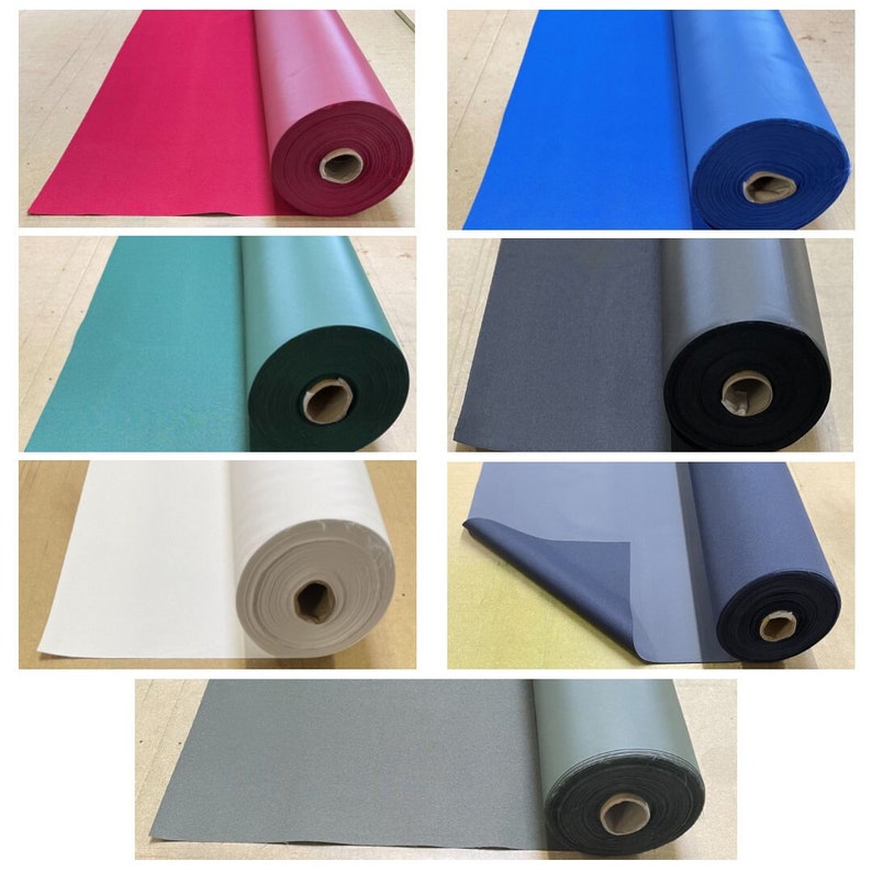 May include: Six rolls of fabric in different colors, including red, blue, green, black, white, and gray. The fabric is rolled up and the ends are visible.