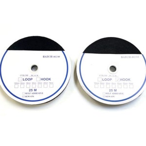 May include: Two rolls of black hook and loop tape, each 25 metres long. The tape is self-adhesive and can also be sewn on. The labels indicate "BATCH 402/80" and "BATCH 402/81".