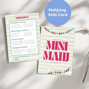 May include: Two Mini Mahj cards. One card has a green border with game instructions. The other card has the words "MINI MAHJ" in pink, with a colourful garland design. A blue circle above the cards reads "Mahjong Kids Card".