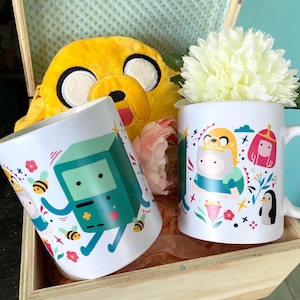 Adventure time finn bmo jake mug. Sold individually.