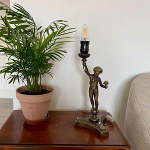 Antique bronze beside table lamp with Putto figurine. Italy. 2917