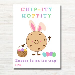 May include: A white card with a cartoon cookie wearing bunny ears and holding a basket of Easter eggs. The text on the card reads "Chip-ity Hoppity Easter is on its way! From:"