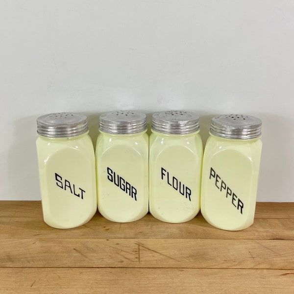 Custard Uranium Glass Range Top Shakers + Matching Metal Lids by Lancaster Glass, Diagonal Lettering Salt, Pepper, flour, and Sugar Shakers