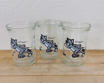 Juice Glasses, 1990 Tom & Jerry Welch's Jelly Jar Juice Glasses Decorated Tom Roller Skating/Blading into a Hole