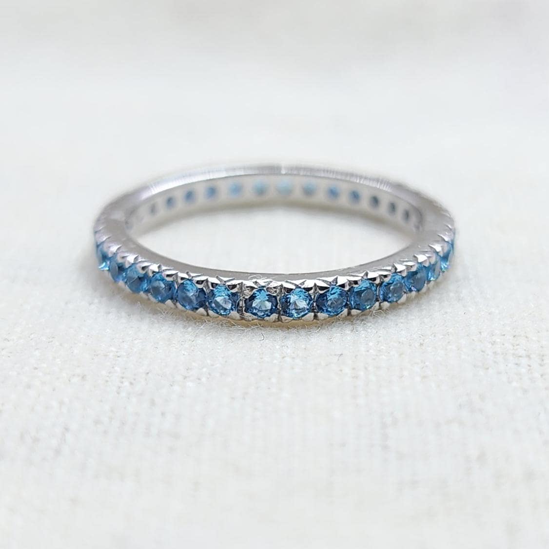 フルエタニティブルートパーズリング、トパーズ結婚指輪、ブルー