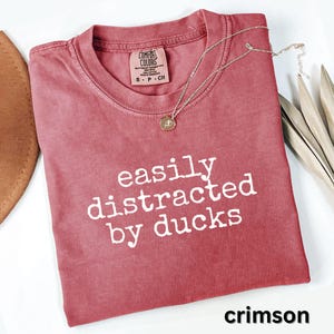 Easily distracted by ducks shirt, funny graphic tee, cute slogan t-shirt, humorous casual wear, gift for duck lovers, crimson shirt