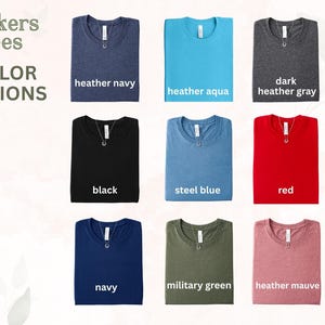 a collection of nine Tuckers Tees in various colors, including navy, navy blue, navy green, navy red, black, steel blue, red, military green, and Heather Mauve.