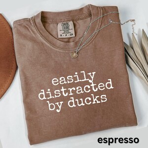Easily distracted by ducks shirt, funny novelty tee, casual graphic t-shirt, quirky humor top, unisex gift idea, espresso color