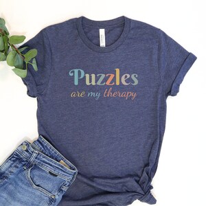 a t - shirt that says puzzles are my therapy