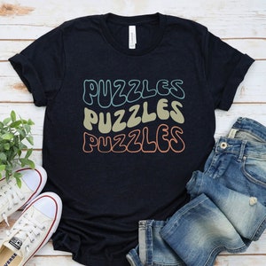 a t - shirt that says puzzles puzzles on it