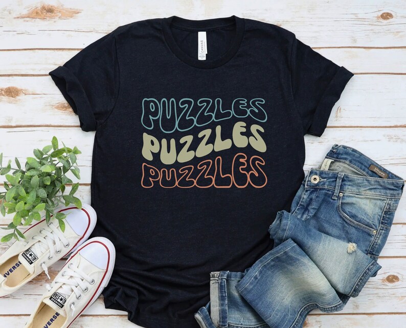 a t - shirt that says puzzles puzzles on it