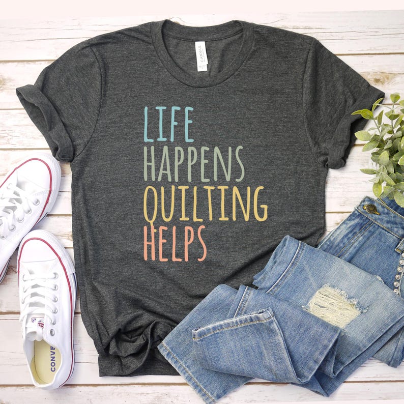 a t - shirt that says life happens quilting helps