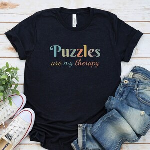 a t - shirt that says puzzles are my therapy