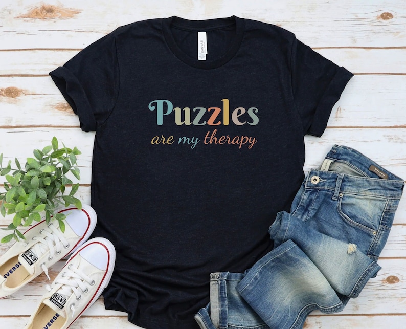 a t - shirt that says puzzles are my therapy