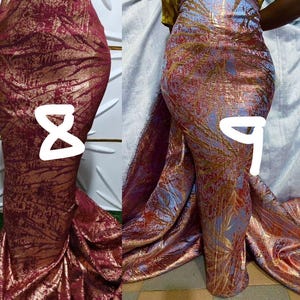 May include: Two floor-length mermaid-style skirts. The skirt labeled 8 is deep burgundy with a metallic gold textured pattern. The skirt labeled 9 is light blue with a metallic gold leaf-like pattern and a long, flowing train extending outward.