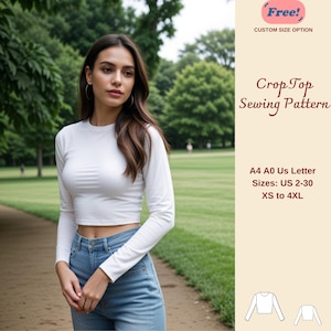 May include: A white long-sleeved crop top sewing pattern in sizes XS to 4XL. The pattern is available in A4, A0, and US Letter sizes. The pattern is shown on a model wearing the top with blue jeans.