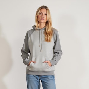 May include: A gray hooded sweatshirt with a contrasting gray and white color block design. The sweatshirt has a kangaroo pocket and a drawstring hood.