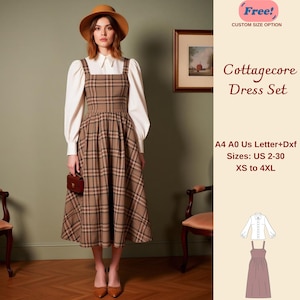 Puede incluir: Un conjunto de vestido Cottagecore a cuadros marrones con una blusa blanca y un sombrero marrón a juego. El vestido tiene un escote cuadrado y una falda acampanada. También incluye el texto "Cottagecore Dress Set" y opciones de tallas.