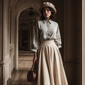 May include: A woman wearing a light green and white patterned button-up shirt with a beige skirt and a light brown hat. She is holding a small round brown purse.