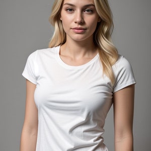 May include: A white t-shirt with short sleeves and a crew neck. The shirt has a small black tag on the bottom right side with the letters "R.L." on it.