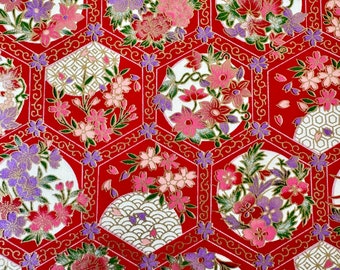 May include: Red fabric with a repeating pattern of gold and white hexagonal designs. Each hexagon contains a circle with a floral design in shades of pink, purple, and green.
