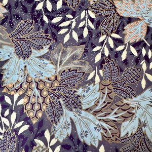 May include: A detailed pattern featuring stylized leaves in shades of blue, purple, and gold. The design includes intricate dot patterns and delicate white leaf accents, creating a rich, textured appearance. The overall aesthetic is reminiscent of vintage botanical illustrations.