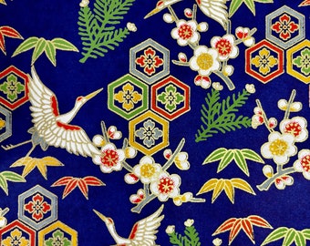 May include: A deep blue background showcases a repeating pattern of white cranes with red detailing, plum blossoms, and geometric shapes. The design incorporates green, yellow, and red leaves, creating a rich, detailed aesthetic.