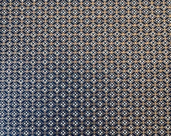 May include: A navy blue fabric with a repeating pattern of white circles and gold interlocking circles.