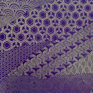 May include: A purple fabric with a white geometric pattern. The pattern is made up of small dots that form different shapes, including circles, hexagons, and clouds.