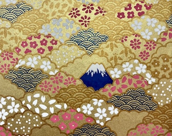 May include: A gold background with a repeating pattern of blue and white waves, pink and white flowers, and blue mountains with white peaks.