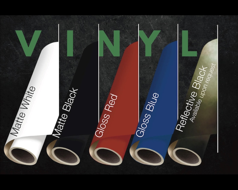 May include: Five rolls of vinyl in matte white, matte black, gloss red, gloss blue, and reflective black. The word VINYL is displayed in green at the top. Each roll is labeled with its color and finish, with reflective black noted as available.