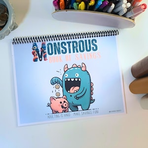May include: A blue and green monster with a big mouth and a pink pig holding coins. The text on the page reads "Monstrous Book of Savings" and "Adulting is hard - Make savings fun!"
