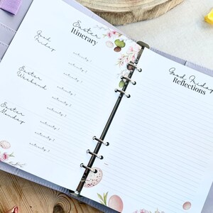 May include: A lavender planner open to lined pages with Easter-themed floral and egg illustrations. The left page lists "Good Friday", "Easter Weekend", and "Easter Monday". The right page is titled "Good Friday Reflections". The top page reads "Easter Itinerary".
