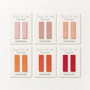May include: Six sets of two rectangular sticky tabs on white backing cards. Each card features the text Forget Me Not STICKY TABS and ava & beaux. The tabs are arranged in a gradient of colors ranging from light pink to dusty rose, peach, orange, red-orange, and deep red.