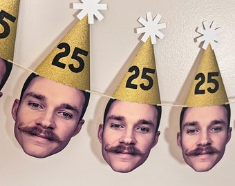 May include: A gold and black birthday banner with the number 25 on each party hat. The banner features a repeating pattern of white stars and a man's face.