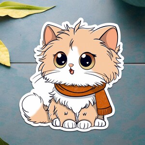 ふわふわのオレンジ色の猫とスカーフのステッカー | 心地よい猫のステッカー | かわいいふわふわの猫のデカール | ニットスカーフの猫のステッカー | 秋の美的猫のステッカー