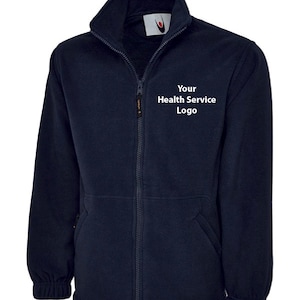 May include: A navy blue fleece jacket with a zip fastening and two pockets. The jacket has a white embroidered logo that says "Your Health Service Logo".