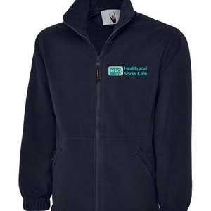 May include: A navy blue fleece jacket with a zip fastening and a logo on the left chest that says "HSC Health and Social Care".