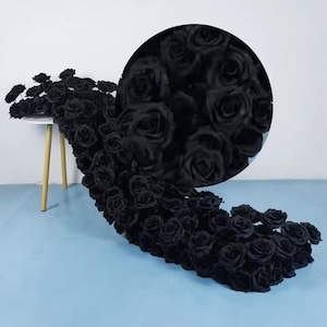 May include: A cascade of black artificial roses, creating a dramatic and elegant display. The roses are arranged in a flowing, cascading pattern, with the individual blooms clustered together to create a full and lush effect.